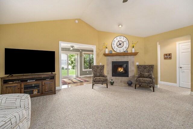 500 Mckinley, Three Rivers, MI 49093 - living area with ceiling fan, carpet, vaulted ceiling, a tiled fireplace, and baseboards