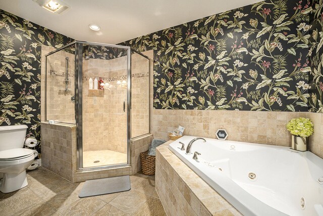500 Mckinley, Three Rivers, MI 49093 - full bathroom with visible vents, a jetted tub, toilet, a stall shower, and wallpapered walls