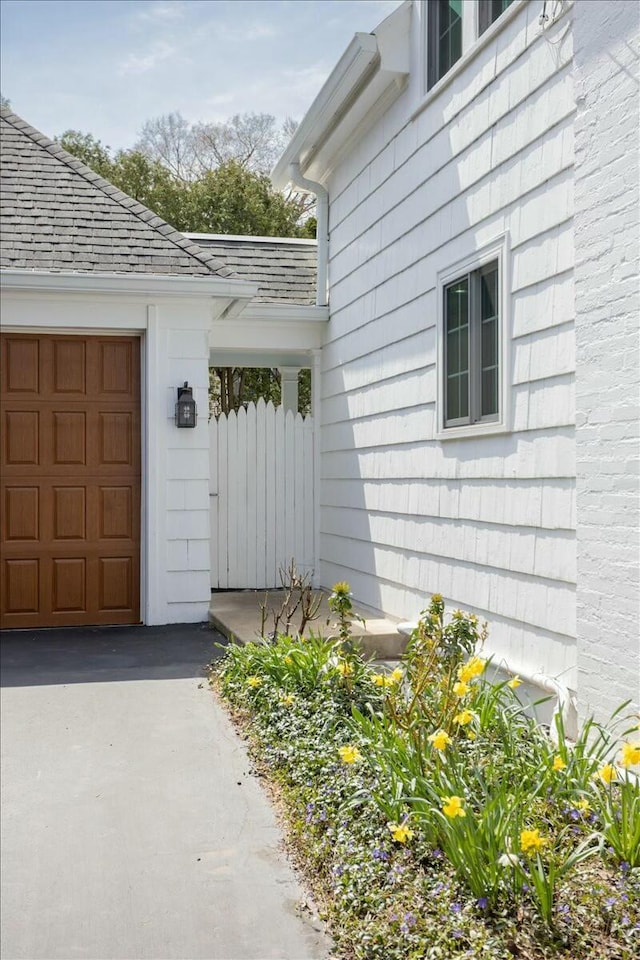 3020 Fulton St SE, Grand Rapids, MI 49506 - property entrance featuring a garage and driveway