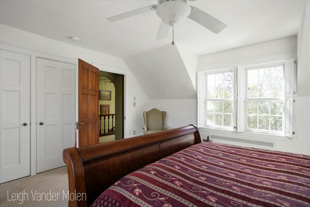 3020 Fulton St SE, Grand Rapids, MI 49506 - bedroom with carpet flooring, radiator heating unit, ceiling fan, and vaulted ceiling