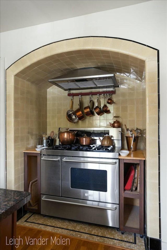 3020 Fulton St SE, Grand Rapids, MI 49506 - bar area with range with two ovens, wood finished floors, and exhaust hood
