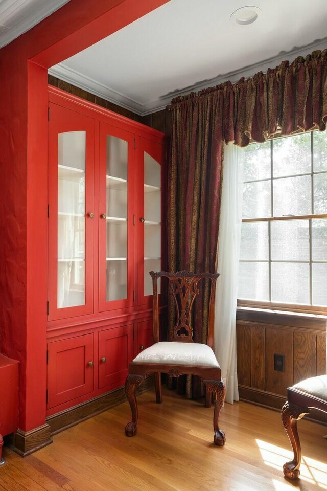 3020 Fulton St SE, Grand Rapids, MI 49506 - living area with ornamental molding and light wood-type flooring