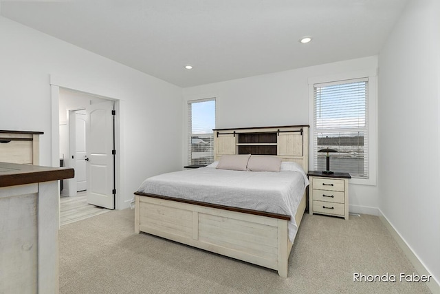 bedroom featuring light carpet, baseboards, and recessed lighting
