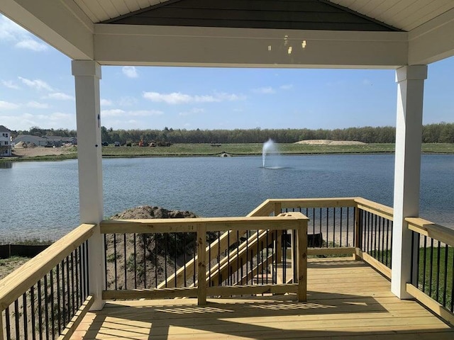 wooden deck featuring a water view