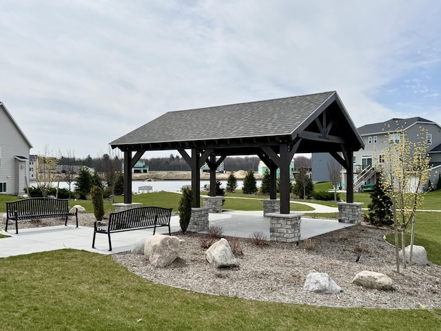 surrounding community featuring a gazebo and a lawn