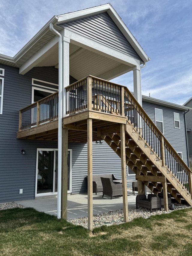 back of house featuring a patio and stairs