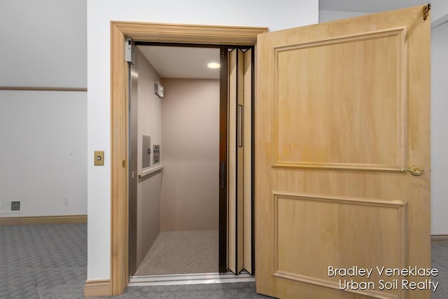 7635 Sandy Hollow Dr SE, Alto, MI 49302 - elevator featuring carpet floors