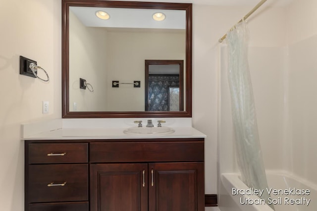 7635 Sandy Hollow Dr SE, Alto, MI 49302 - full bathroom featuring vanity, shower / bathtub combination with curtain, and recessed lighting