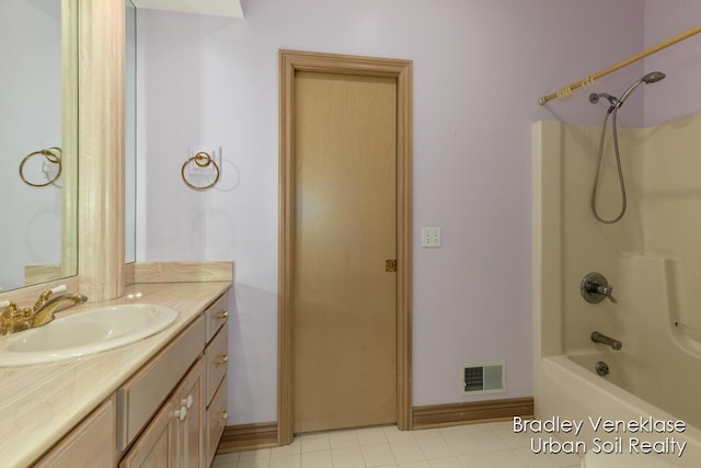7635 Sandy Hollow Dr SE, Alto, MI 49302 - full bathroom featuring vanity, shower / bathtub combination, tile patterned flooring, and baseboards