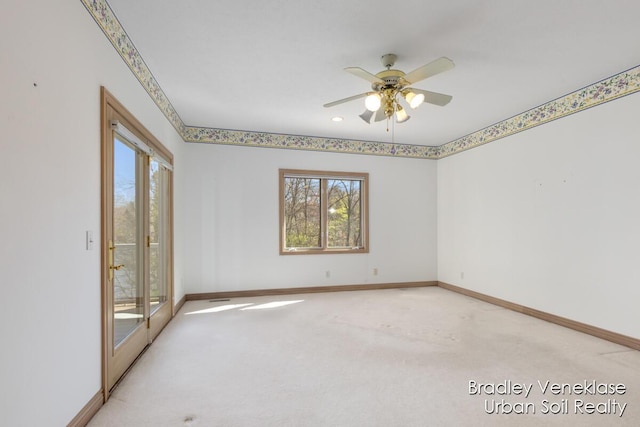 7635 Sandy Hollow Dr SE, Alto, MI 49302 - unfurnished room with baseboards, light colored carpet, and ceiling fan