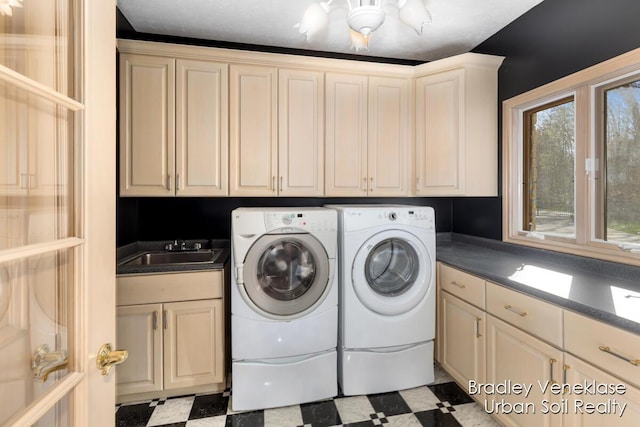 7635 Sandy Hollow Dr SE, Alto, MI 49302 - washroom with tile patterned floors, cabinet space, washing machine and clothes dryer, and a chandelier
