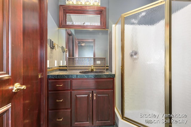 7635 Sandy Hollow Dr SE, Alto, MI 49302 - full bath featuring a shower stall, vanity, and backsplash