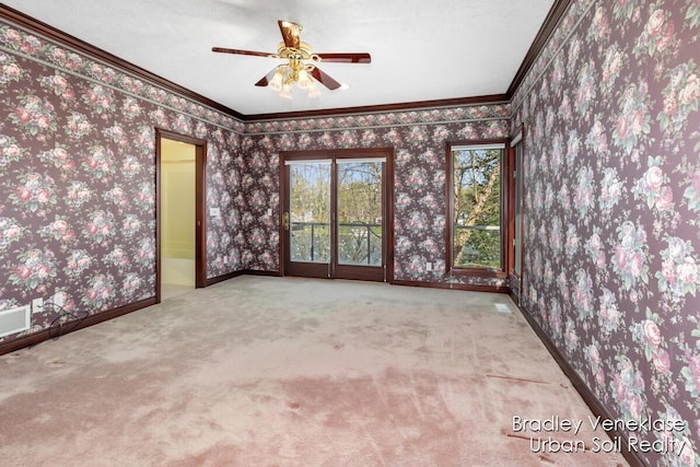 7635 Sandy Hollow Dr SE, Alto, MI 49302 - carpeted spare room with wallpapered walls, ornamental molding, ceiling fan, and baseboards