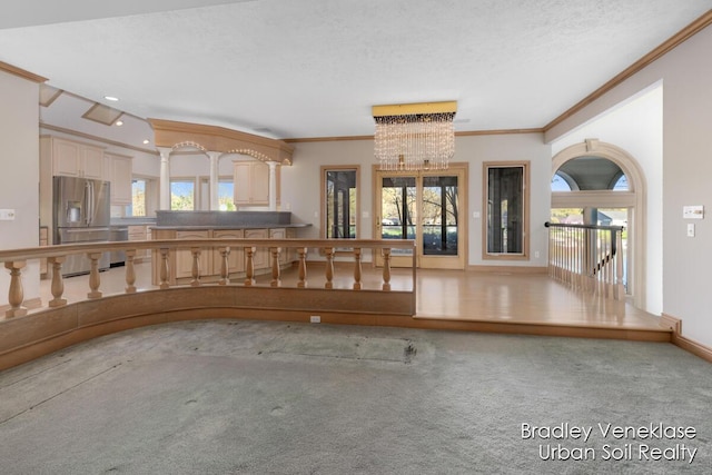 7635 Sandy Hollow Dr SE, Alto, MI 49302 - kitchen featuring stainless steel appliances, ornamental molding, carpet, a chandelier, and recessed lighting