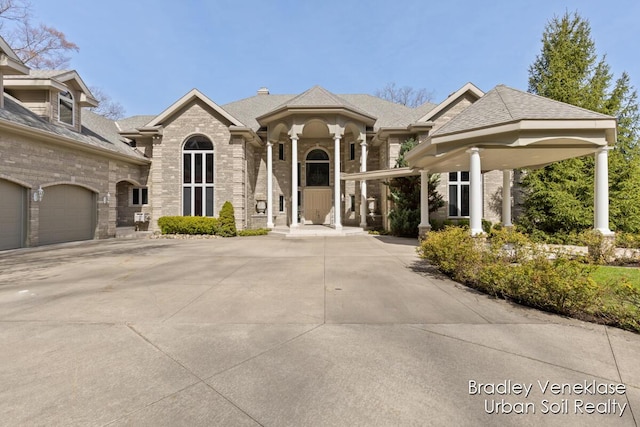7635 Sandy Hollow Dr SE, Alto, MI 49302 - view of front facade with brick siding and roof with shingles