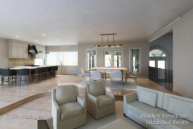 7635 Sandy Hollow Dr SE, Alto, MI 49302 - living room with light wood-style floors, crown molding, and recessed lighting