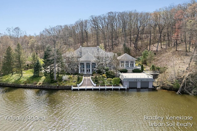 7635 Sandy Hollow Dr SE, Alto, MI 49302 - dock area featuring a water view and a wooded view