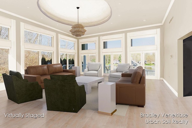 7635 Sandy Hollow Dr SE, Alto, MI 49302 - living room featuring a high ceiling, crown molding, light wood finished floors, a chandelier, and baseboards