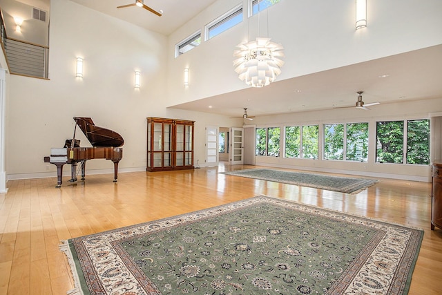 20 Hiawatha Dr, Battle Creek, MI 49015 - living area with a ceiling fan, light wood-type flooring, and a towering ceiling