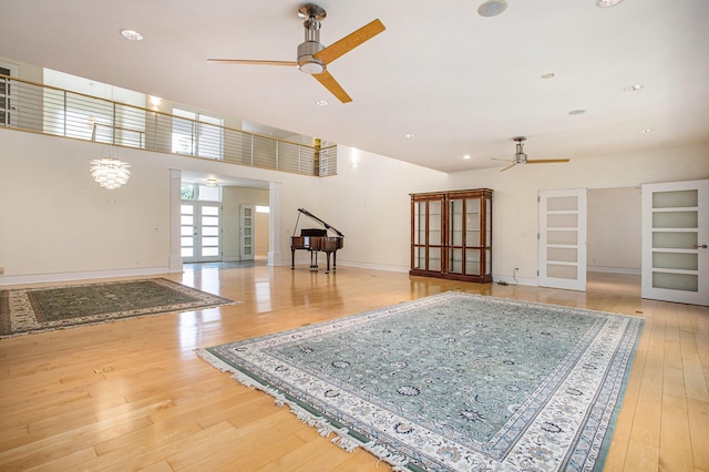 20 Hiawatha Dr, Battle Creek, MI 49015 - unfurnished living room featuring ceiling fan, french doors, hardwood / wood-style flooring, and recessed lighting
