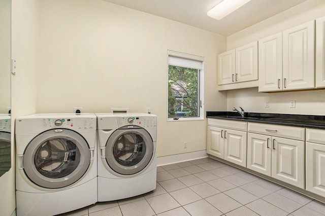 20 Hiawatha Dr, Battle Creek, MI 49015 - laundry room with cabinet space, washer and dryer, and light tile patterned flooring