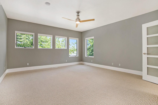 20 Hiawatha Dr, Battle Creek, MI 49015 - empty room with ceiling fan and light carpet