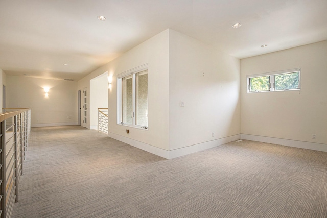20 Hiawatha Dr, Battle Creek, MI 49015 - spare room featuring light carpet and baseboards