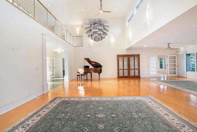 20 Hiawatha Dr, Battle Creek, MI 49015 - living area featuring ceiling fan, wood finished floors, and a towering ceiling