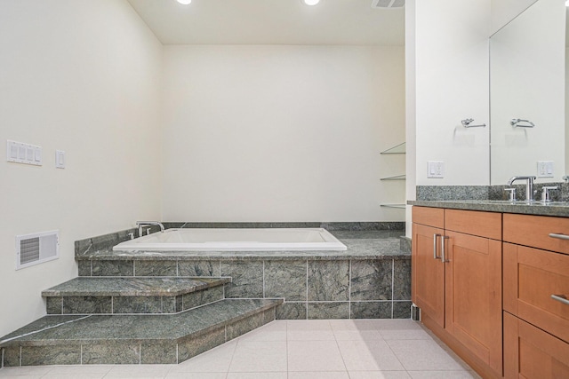 20 Hiawatha Dr, Battle Creek, MI 49015 - full bathroom featuring vanity, a garden tub, tile patterned flooring, and recessed lighting