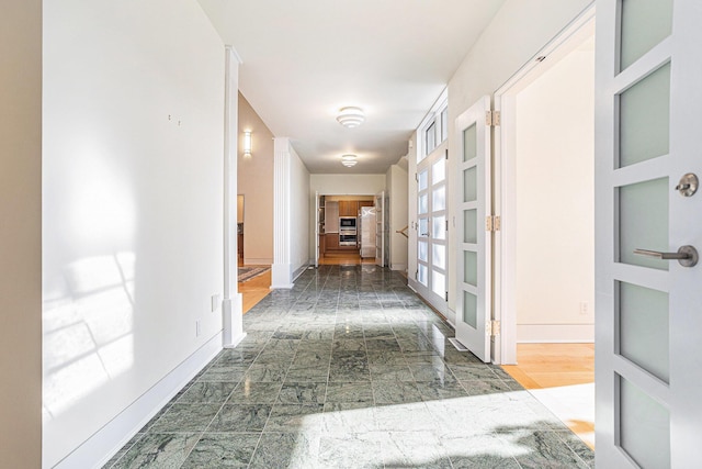 20 Hiawatha Dr, Battle Creek, MI 49015 - hall featuring baseboards and french doors