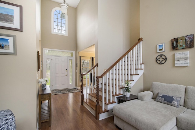 5371 S 4th St, Kalamazoo, MI 49009 - foyer featuring dark wood-type flooring, a towering ceiling, stairs, and baseboards