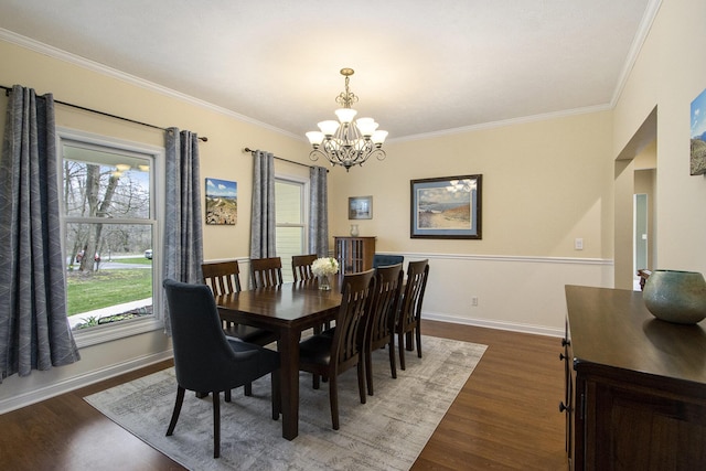 5371 S 4th St, Kalamazoo, MI 49009 - dining area featuring a chandelier, crown molding, wood finished floors, and baseboards