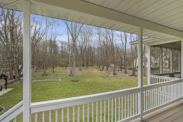 5371 S 4th St, Kalamazoo, MI 49009 - deck with a lawn, a sunroom, and view of scattered trees
