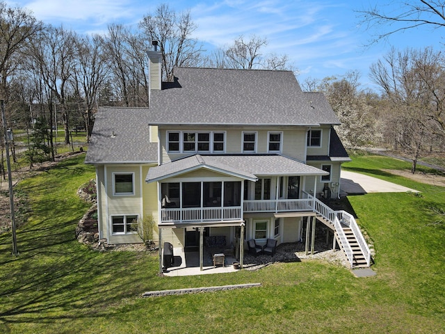 5371 S 4th St, Kalamazoo, MI 49009 - back of property featuring a chimney, a shingled roof, a patio, and a sunroom
