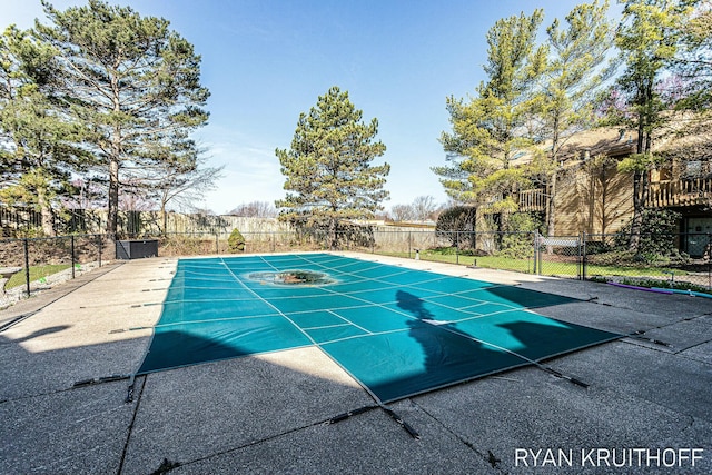 view of basketball court with fence