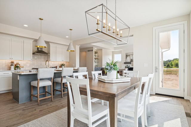 8167 Turning Stone, Kalamazoo, MI 49009 - dining area featuring light wood-style floors, recessed lighting, and a chandelier