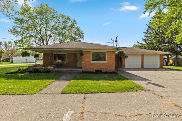 4733 136th Ave, Hamilton, MI 49419 - view of front of home featuring brick siding, driveway, a front yard, and covered porch