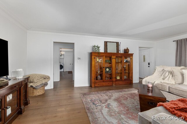4733 136th Ave, Hamilton, MI 49419 - living room featuring washer / dryer, crown molding, and wood finished floors