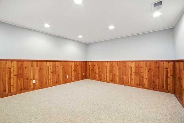256 Bona Vista Dr NW, Grand Rapids, MI 49504 - spare room featuring wood walls, a wainscoted wall, visible vents, and recessed lighting