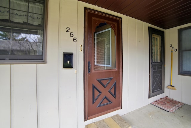 256 Bona Vista Dr NW, Grand Rapids, MI 49504 - property entrance with board and batten siding