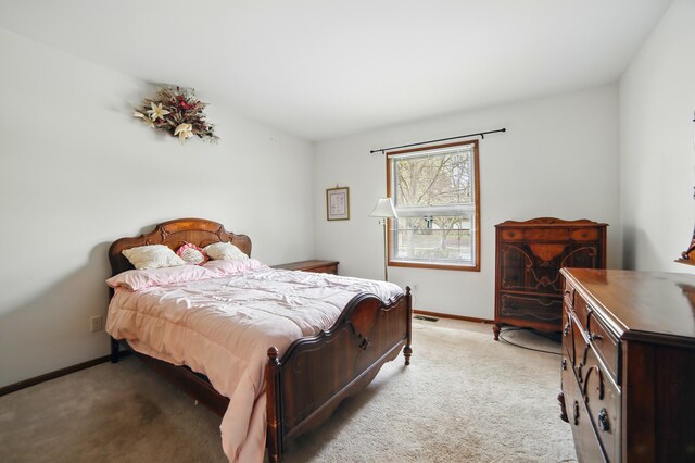 256 Bona Vista Dr NW, Grand Rapids, MI 49504 - bedroom with baseboards and light carpet