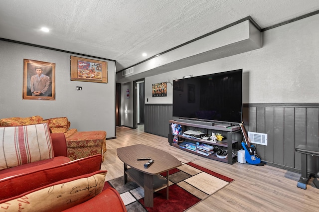 8524 E B Ave, Richland, MI 49083 - living area with a textured ceiling, wood finished floors, wainscoting, and recessed lighting