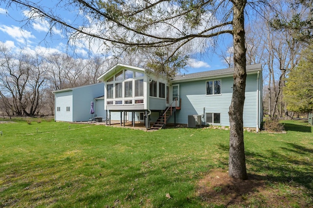8524 E B Ave, Richland, MI 49083 - back of house with a sunroom, a yard, cooling unit, and stairway