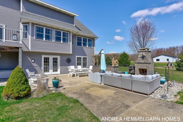 4459 36th St, Hamilton, MI 49419 - back of property with fence, a shingled roof, an outdoor living space with a fireplace, a patio area, and french doors