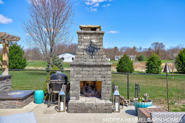 4459 36th St, Hamilton, MI 49419 - view of patio with fence and an outdoor stone fireplace