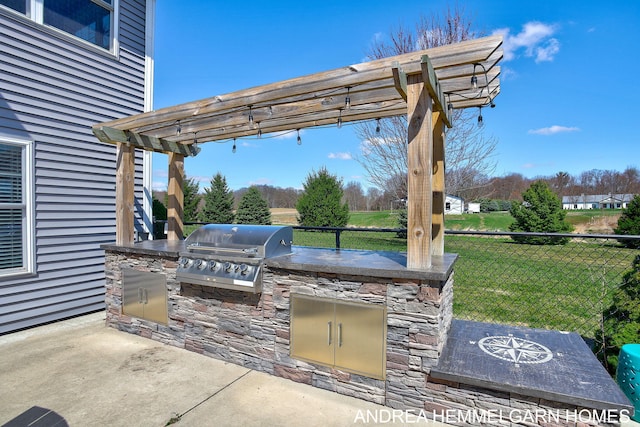 4459 36th St, Hamilton, MI 49419 - view of patio / terrace with a pergola, grilling area, an outdoor kitchen, and fence