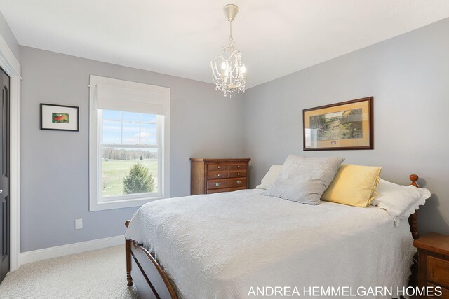 4459 36th St, Hamilton, MI 49419 - carpeted bedroom featuring baseboards and an inviting chandelier