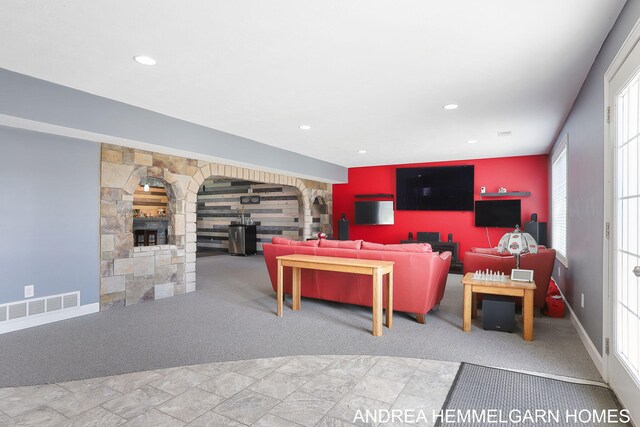4459 36th St, Hamilton, MI 49419 - carpeted living area featuring a fireplace, visible vents, baseboards, and recessed lighting