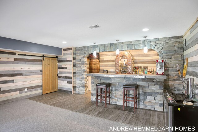 4459 36th St, Hamilton, MI 49419 - bar featuring a barn door, visible vents, wood walls, and a bar