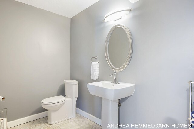 4459 36th St, Hamilton, MI 49419 - bathroom featuring baseboards and toilet